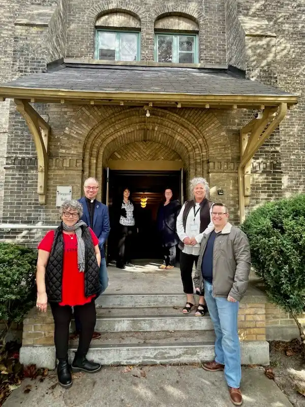 Tattoos 4 Trauma organizers and County staff members standing on the front steps of St.Peter's church